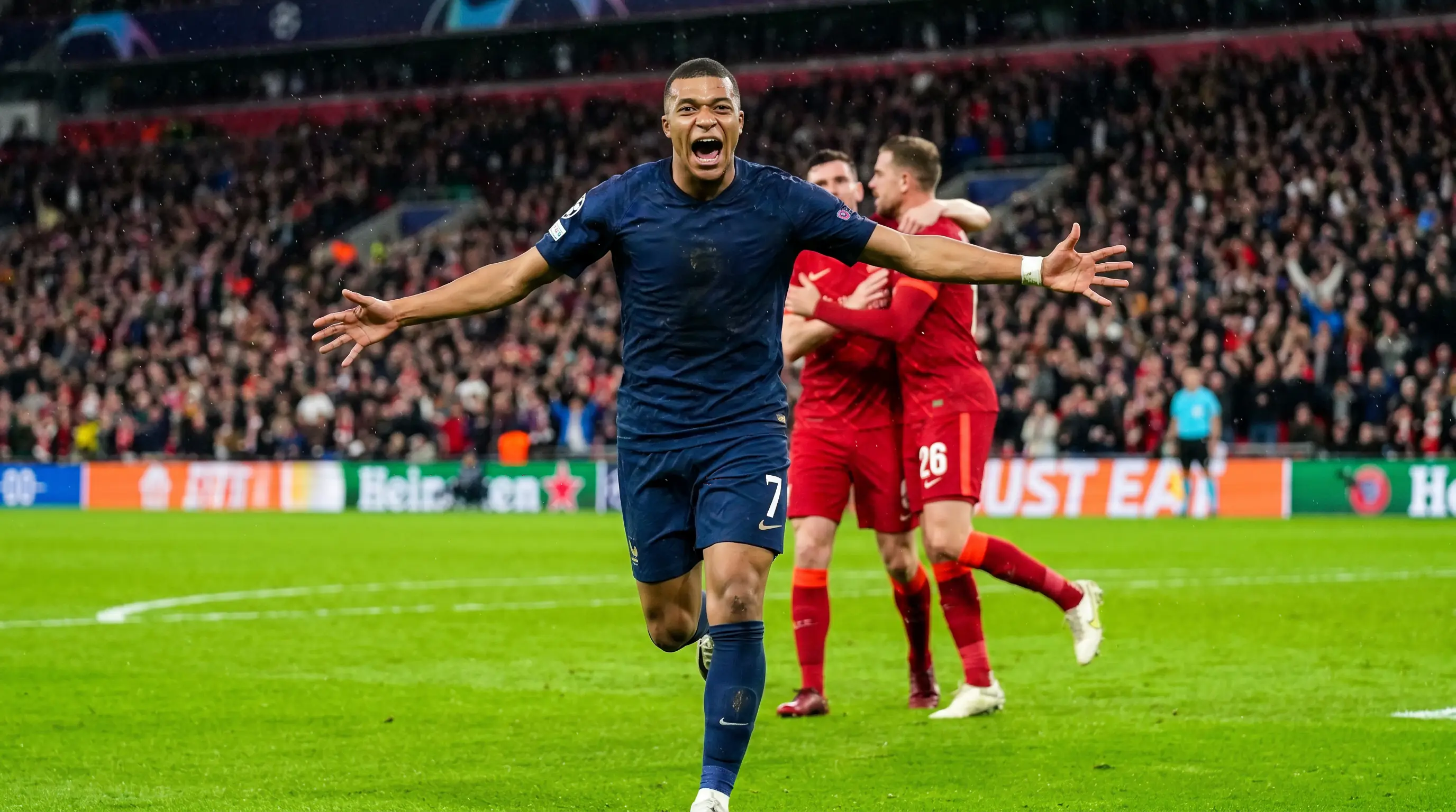 Football striker celebrating after scoring the opening goal in an English league match