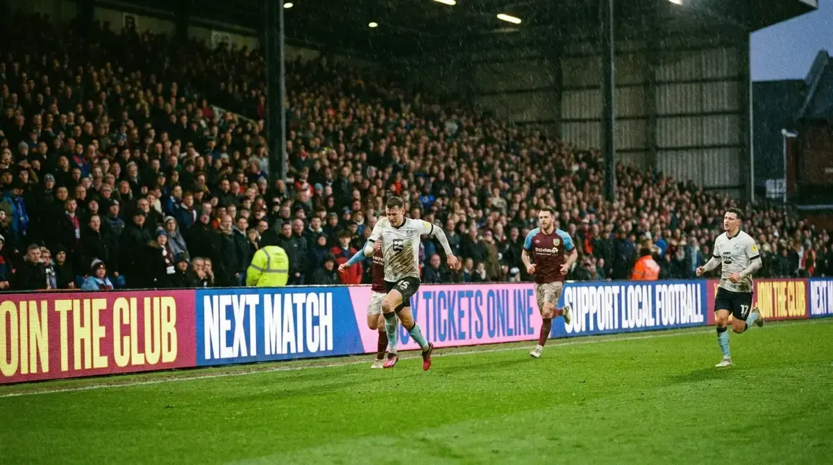 LED perimeter advertising boards around English football pitch during match