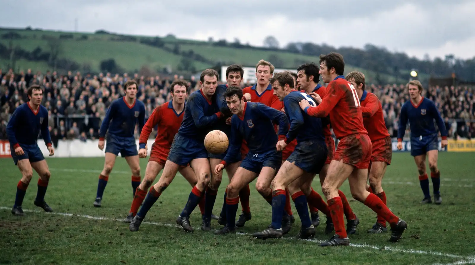 League One teams in a tight defensive formation during a match