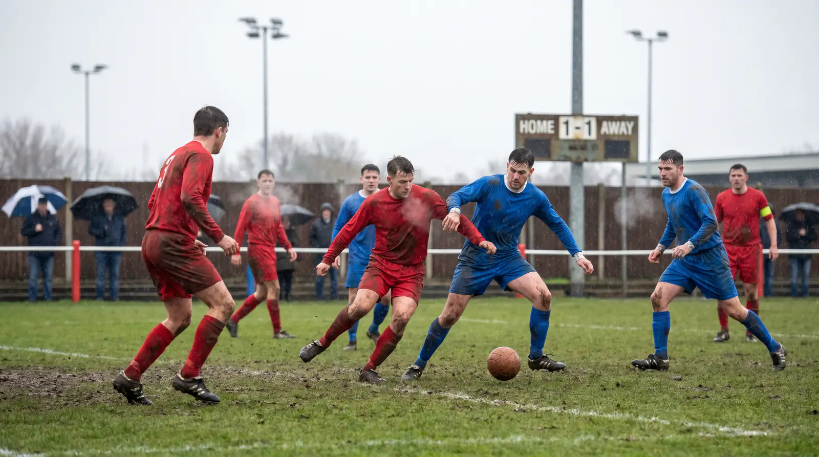 National League match on a worn winter pitch surface in poor conditions