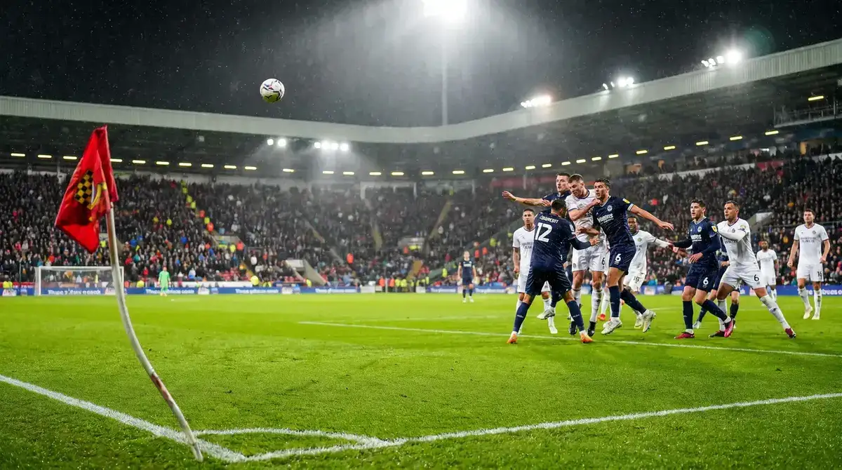 Corner kick delivery during Premier League match with players positioned in box